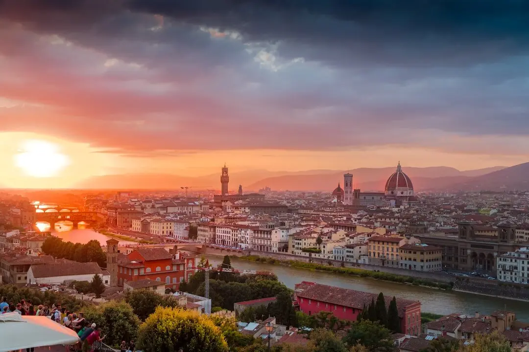 Breathtaking view of the Florence skyline at sunset, featuring the Duomo and historic architecture on a private tour.
